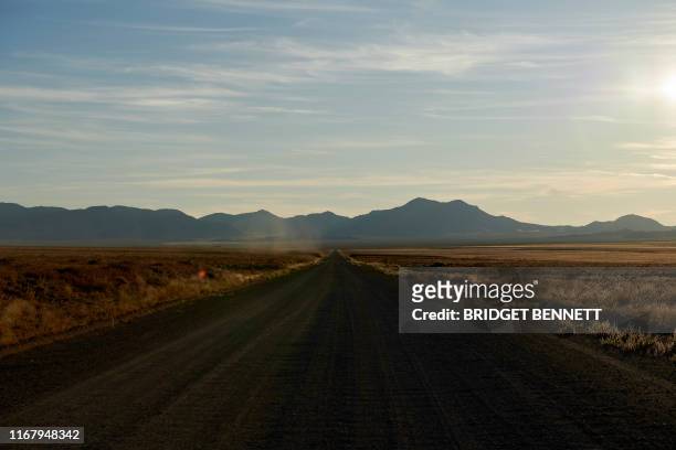 Long, desolate dirt road leads to a gate of the Nevada Test and Training Range, commonly referred to as Area 51, near Rachel, Nevada, on September...