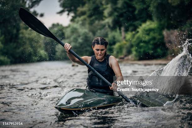 woman in a kayak - kayaking rapids stock pictures, royalty-free photos & images