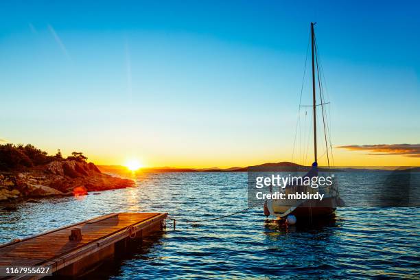 sailboat at sunrise - croatia sailing stock pictures, royalty-free photos & images