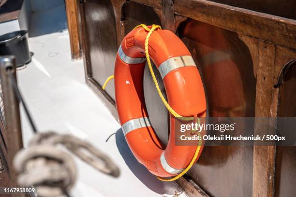 one orange lifebuoys on board the ship - life ring buoy stock pictures, royalty-free photos & images