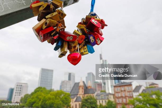 padlocks from eiserner steg bridge in frankfurt - love lock stock pictures, royalty-free photos & images