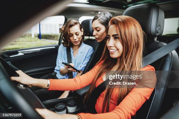 millennials using car pooling service and sharing rides in latin america - latin american and hispanic ethnicity driver stock pictures, royalty-free photos & images