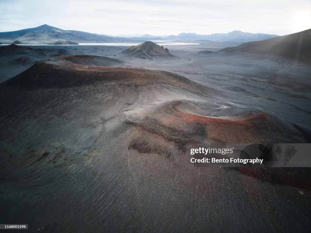 Aerial view of Volcanoes and gravel road in Highland, Iceland