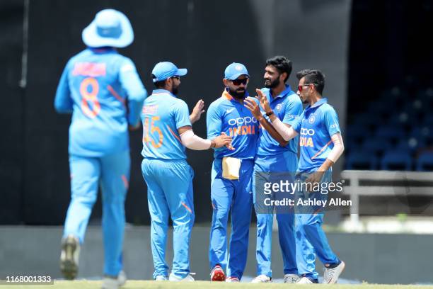 India celebrate the dismissal of Chris Gayle of the West Indies during the third MyTeam11 ODI between the West Indies and India at the Queen's Park...