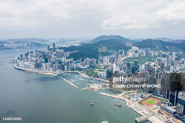 view of the hong kong skyline - hong kong skyline drone stock pictures, royalty-free photos & images