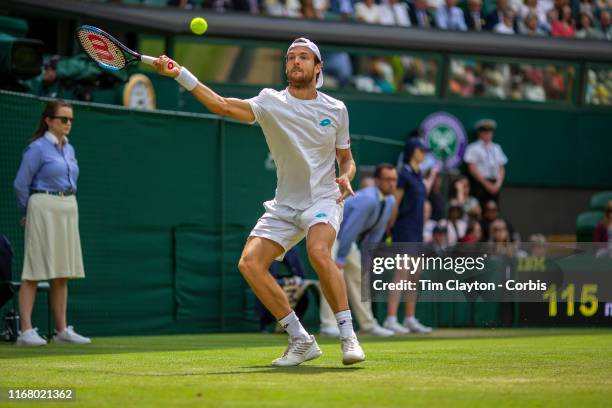 July 08: Joao Sousa of Portugal in action against Rafael Nadal of Spain in the Men's Singles fourth round match on Centre Court during the Wimbledon...