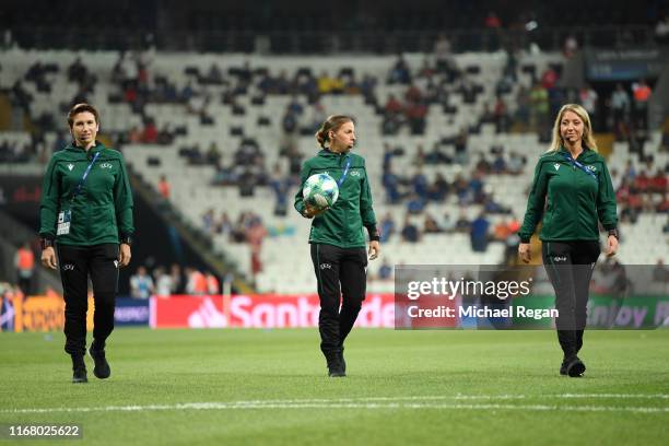 Referee Stephanie Frappart and assistant referees Manuela Nicolosi and Michelle O'Neill inspect the pitch prior to the UEFA Super Cup match between...