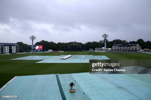 Rain covers are seen on the field of play as rain delays plays prior to the T20 Vitality Blast match between Kent Spitfires and Glamorgan at The...