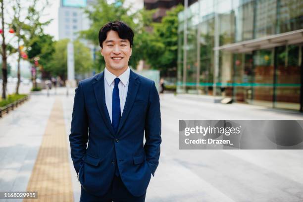 portrait of smart south korean businessman in suit - korean culture stock pictures, royalty-free photos & images