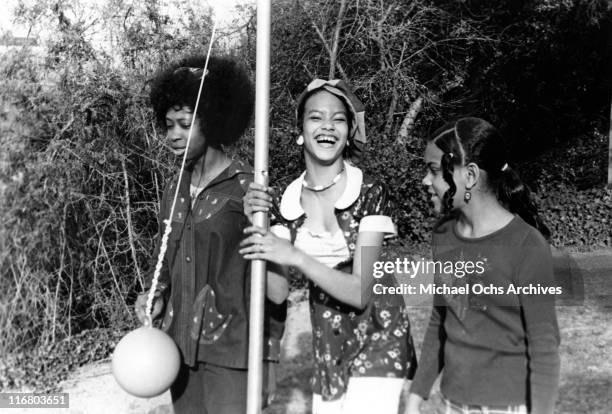 Angie Sylvers and her sister Patricia Sylvers of the R and B group The Sylvers play tetherball with a friend in their garden at home on February 17,...