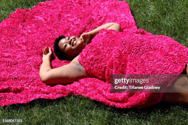 plus size model basking in sun on flower dress - plus size fashion stock pictures, royalty-free photos & images