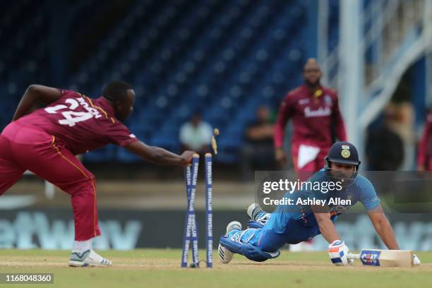 Rohit Sharma of India is run-out by Fabian Allen and Kemar Roach of the West Indies during the third MyTeam11 ODI between the West Indies and India...