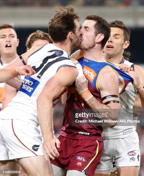 Jeremy Finlayson of the Giants and Darcy Gardiner of the Lions wrestle during the 2019 AFL Second Semi Final match between the Brisbane Lions and the...