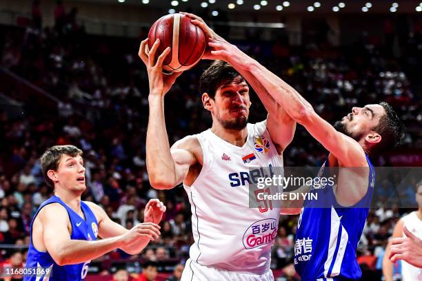 Boban Marjanovic of Serbia fight for the ball during the games 5-6 match between Serbia and the Czech Republic of 2019 FIBA World Cup at the Cadillac...