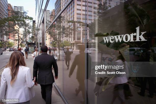 Sign marks the location of a WeWork office facility on August 14, 2019 in Chicago, Illinois. WeWork, a real estate firm that leases shared office...