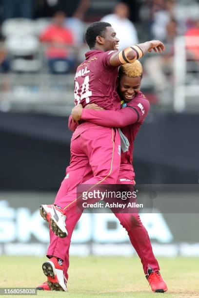 Shimron Hetmyer and Keemo Paul of the West Indies celebrate a wicket during the third MyTeam11 ODI between the West Indies and India at the Queen's...
