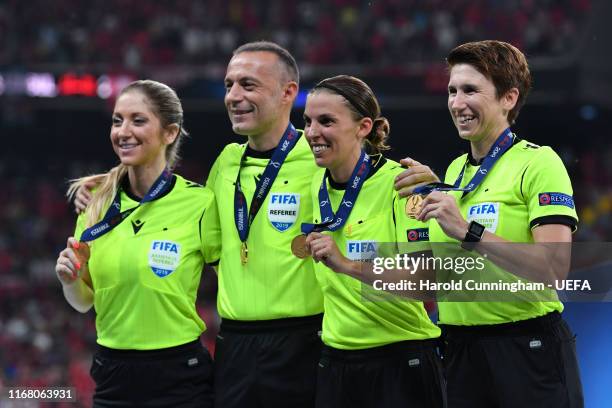 Assistant referee Manuela Nicolosi, fourth official, Cüneyt Çakır, match referee Stephanie Frappart and assistant referee Michelle O Neill pose with...