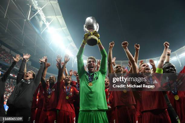 Adrian of Liverpool lifts the UEFA Super Cup trophy as Liverpool celebrates victory following the UEFA Super Cup match between Liverpool and Chelsea...