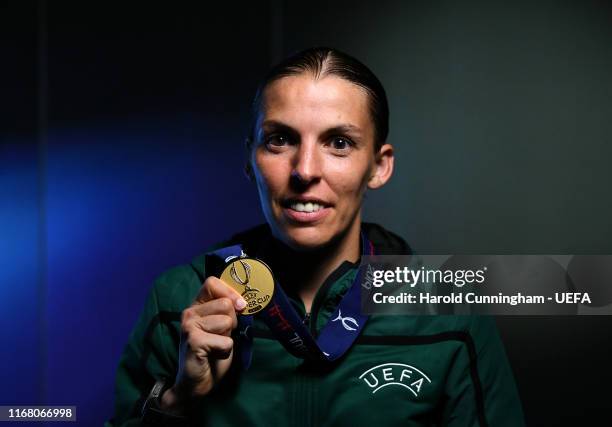 Match referee Stephanie Frappart poses for a photo with her medal following the UEFA Super Cup match between Liverpool and Chelsea at Vodafone Park...