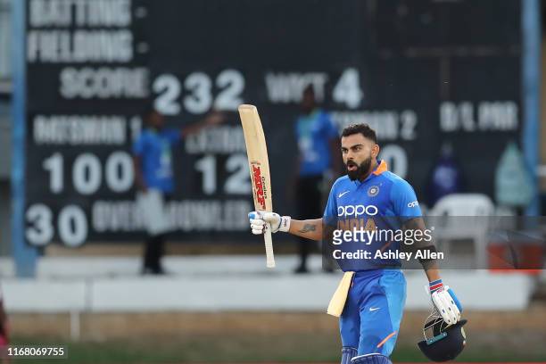 Virat Kohli of India brings up his hundred during the third MyTeam11 ODI between the West Indies and India at the Queen's Park Oval on August 14,...