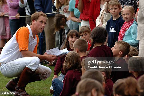 Prince William chats to children when he plays for Apes Hill Club Barbados against Churchill Retirement Living for the Calcot Manor Hotel Cup at the...