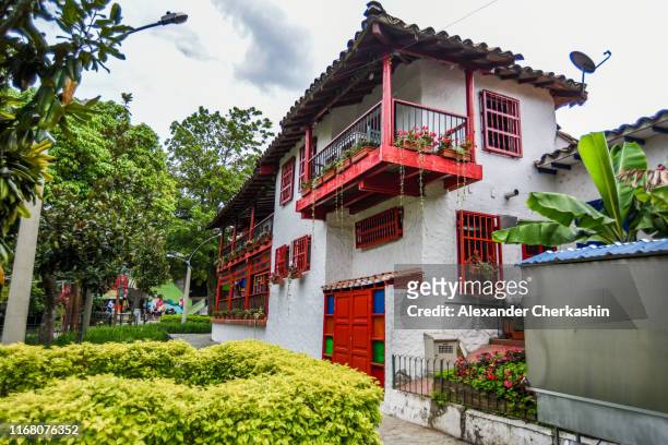 yellow and red building in cultural village pueblito paisa in medellin - メデリン ストックフォトと画像