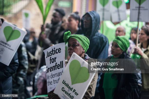 Survivors of the Grenfell Tower disaster are joined by Fire Fighters and supporters on the monthly silent march at Grenfell Tower on August 14, 2019...