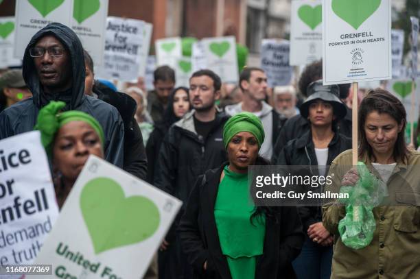 Survivors of the Grenfell Tower disaster are joined by Fire Fighters and supporters on the monthly silent march at Grenfell Tower on August 14, 2019...