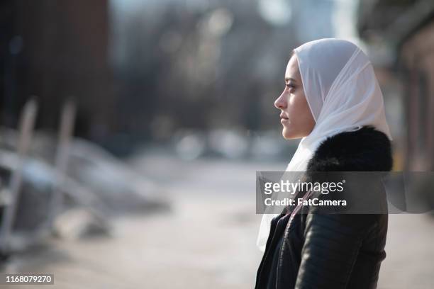 somber muslim women - islam stock pictures, royalty-free photos & images