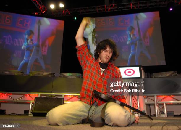 Alex Lerner, 19 from River Dale, New Jersey concludes his winning performance during the Guitar Hero II video game contest presented by Target at the...