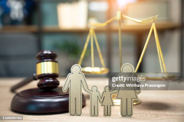 family figure and gavel on table. family law concept - human rights lawyer stock pictures, royalty-free photos & images