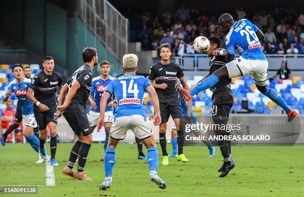 Napoli's Senegalese defender Kalidou Koulibaly and Sampdoria's Colombian defender Jeison Murillo go for a header during the Italian Serie A football...