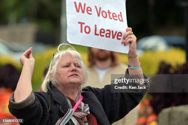 Lone pro-Brexit protester makes her point during a rally organised by Fife Trades Union Council to promote sustainable jobs in Fife, in the wake of...