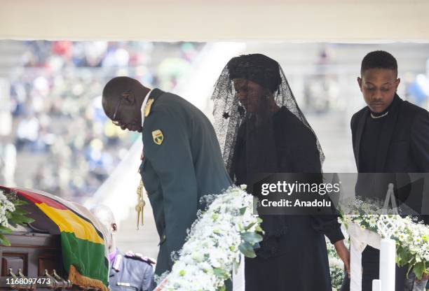 Grace Mugabe , wife of Zimbabwe's late former president, Robert Mugabe, and Robert Mugabe's son Chatunga Bellarmine Mugabe attend a funeral ceremony...