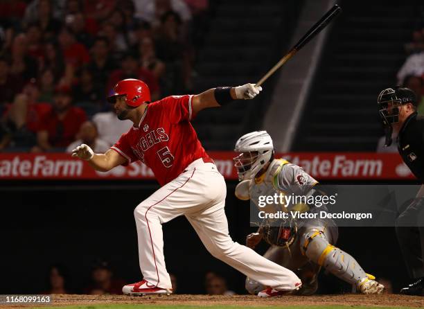 Albert Pujols of the Los Angeles Angels singles to center field n the eighth inning of the MLB game against the Pittsburgh Pirates at Angel Stadium...