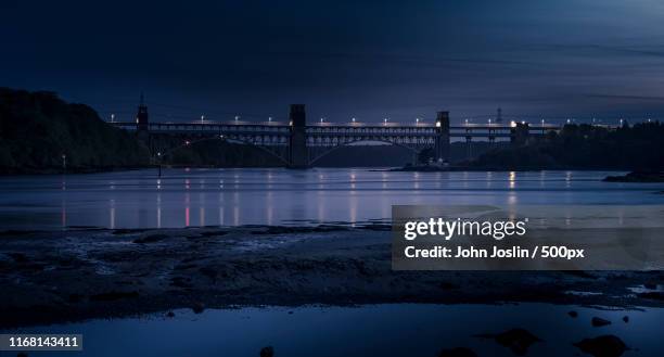 dusk at britannia bridge - menai straits stock pictures, royalty-free photos & images