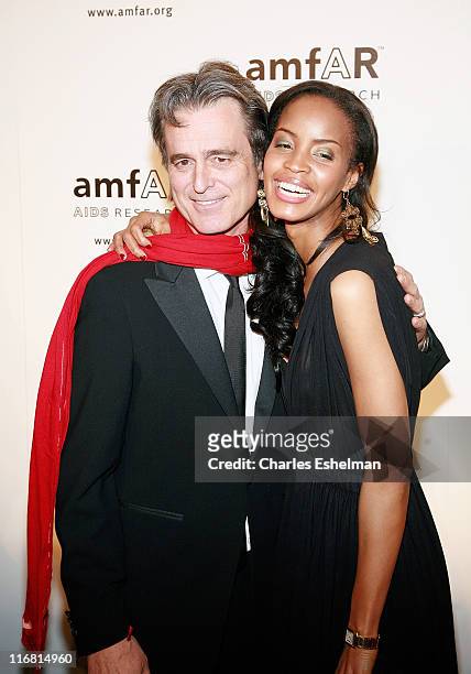 Inc. President Bobby Shriver and model-actress Georgianna Robertson attend the 10th annual amfAR New York Gala on January 31, 2008 at the 42nd Street...