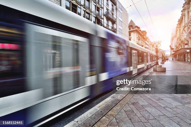 geneva old town and city traffic, switzerland - tram stock-fotos und bilder