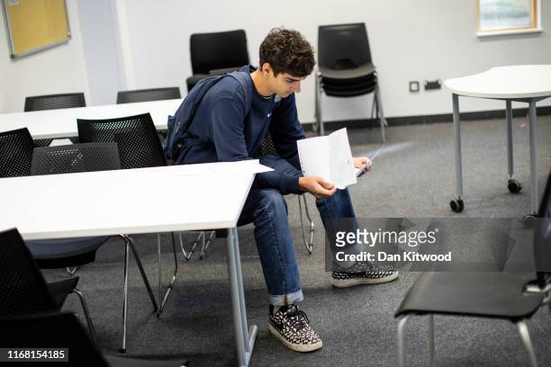 Sixth form student receives their A-Level results at Stoke Newington School on August 15, 2016 in London, England. Over 300,000 teenagers are getting...