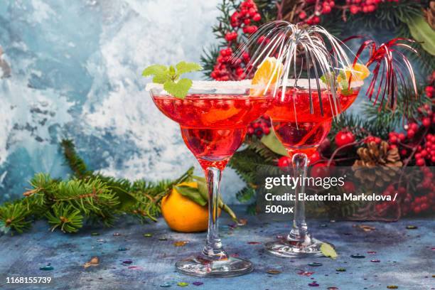 pomegranage and tangerine martini - tangerine martini stock pictures, royalty-free photos & images