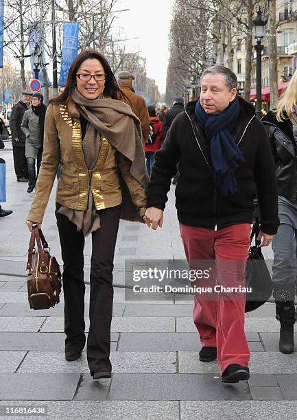 Michelle Yeoh and Jean Todt walk down the Champs Elysees before the premiere of the film "Asterix at the Olympic Games" on January 14, 2008 Paris,...