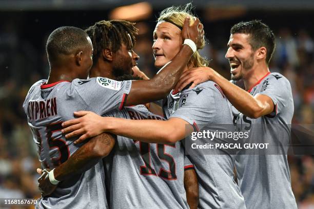 Nice's players react after scoring a goal during the French L1 football match between Montpellier Herault SC and OGC Nice at The Mosson Stadium in...