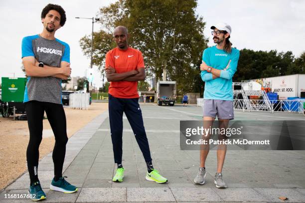 Cameron Levins of Canada, Abdi Abdirahman of the United States, and Noah Droddy of the United States take part in a shakeout run with runners taking...