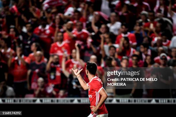 Benfica's Portuguese midfielder Gedson Fernandes celebrates after scoring a goal during the Portuguese League football match between SL Benfica and...