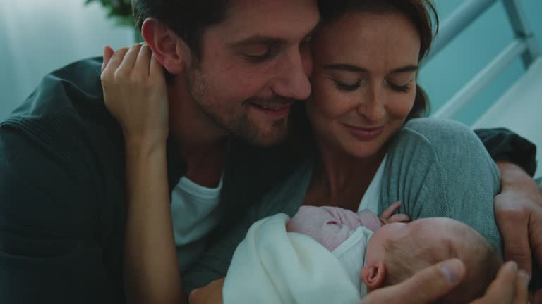 https://media.gettyimages.com/id/1168187176/video/happy-young-man-embracing-wife-and-newborn-baby.jpg?b=1&s=640x640&k=20&c=9j-nzPKrqyxfGM6yb4-tTr4vFd7Iq2JNR6LT6J1M87Y=