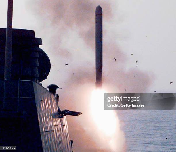 Ship launches a Tomahawk cruise missile in this undated file photo. U.S. And British warplanes and sea-launched missiles struck at air defenses, air...