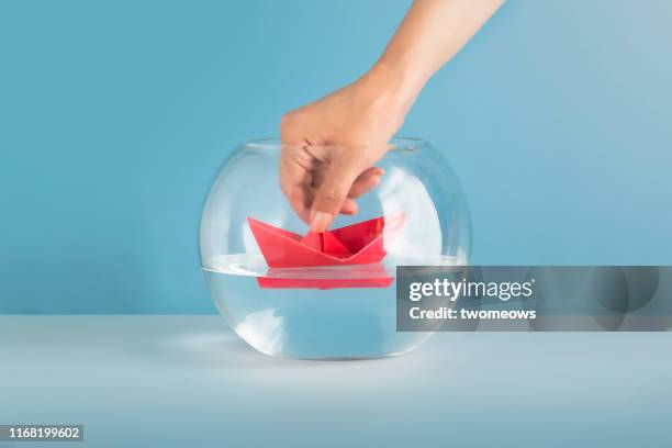 no risk taking concept image. - origami boat stock pictures, royalty-free photos & images