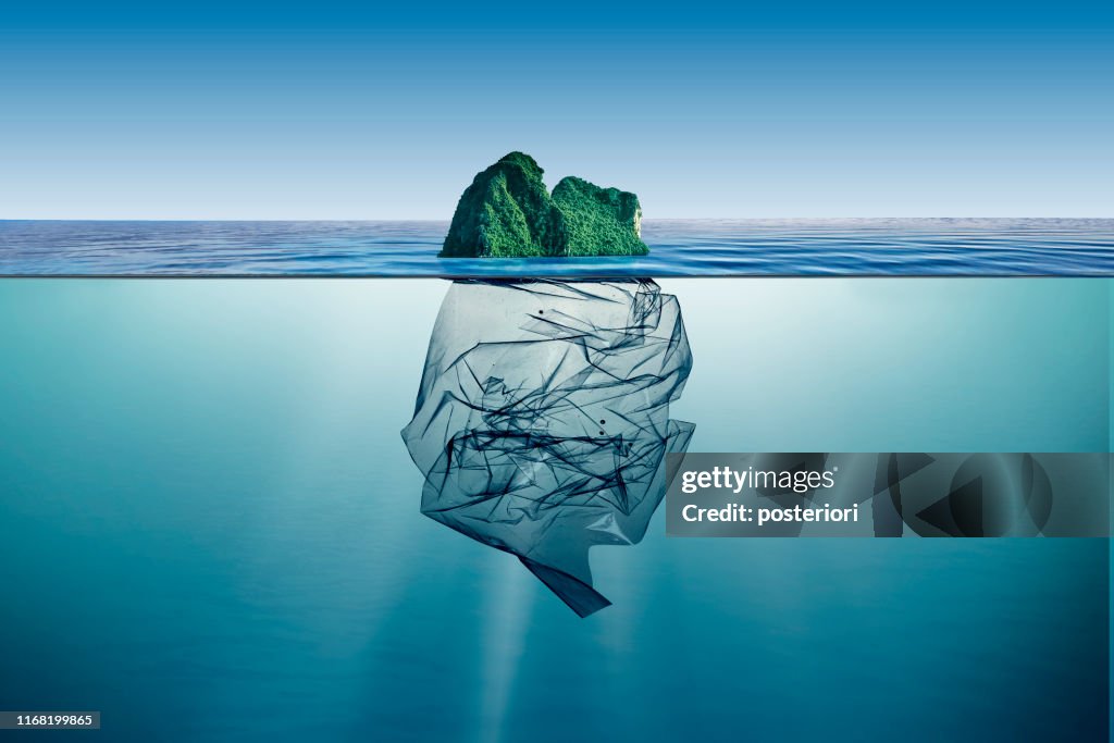 Garbage plastic with island floating in the ocean