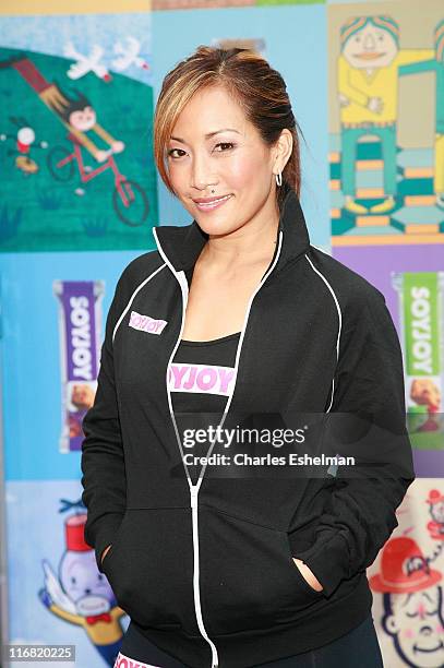 Actress Carrie Ann Inaba attends the Times Square Alliance summer solstice yoga-thon on June 21, 2008 at Military Island in Times Square in New York.