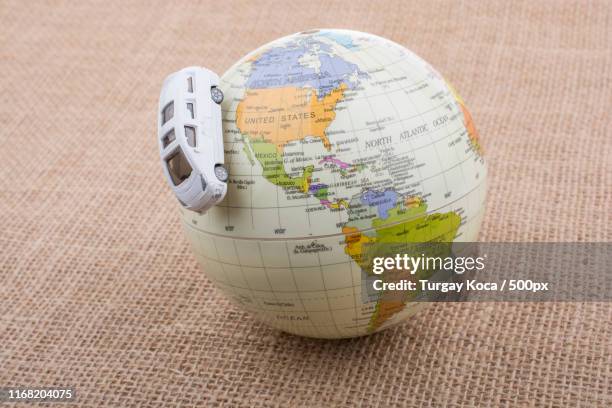 globe placed on canvas background - coverage map stock pictures, royalty-free photos & images
